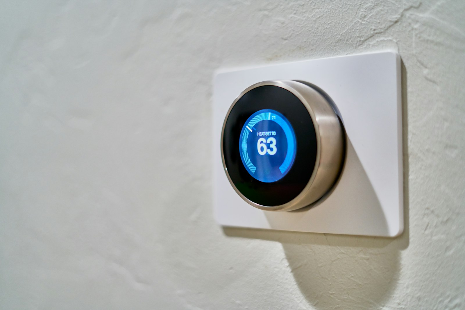 A smart thermostat on the wall